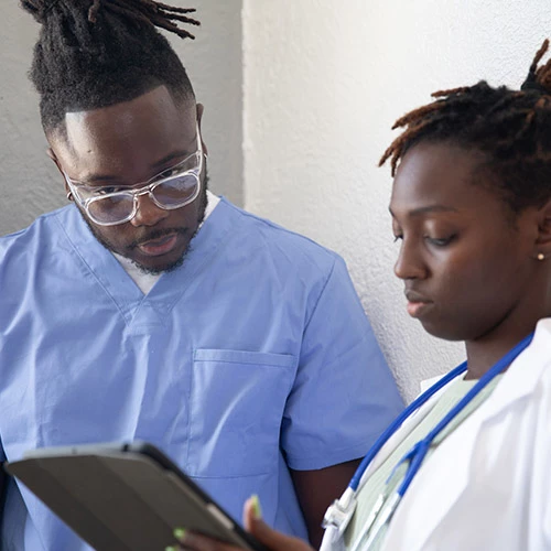 medical-IT Community Health Centers workers using a tablet