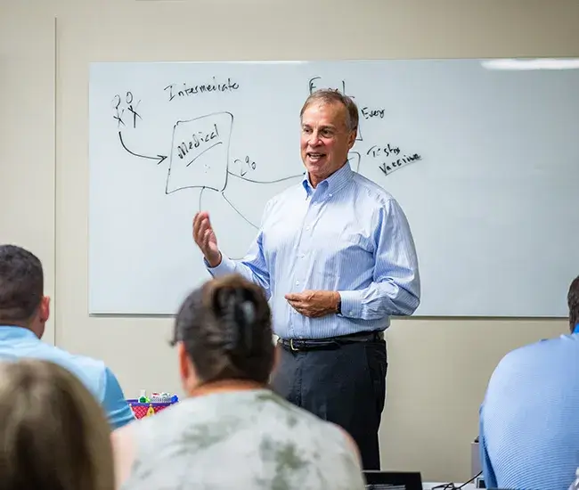 man-speaking-at-training A Man Speaking At A Training Session